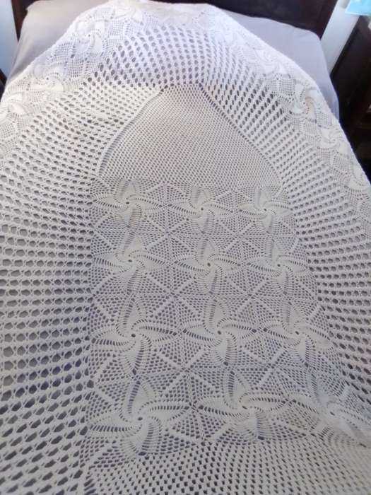 A extra large Hand Crocheted oblong/oval Tablecloth Size: 2.8mx1.7m in Excellent condition.