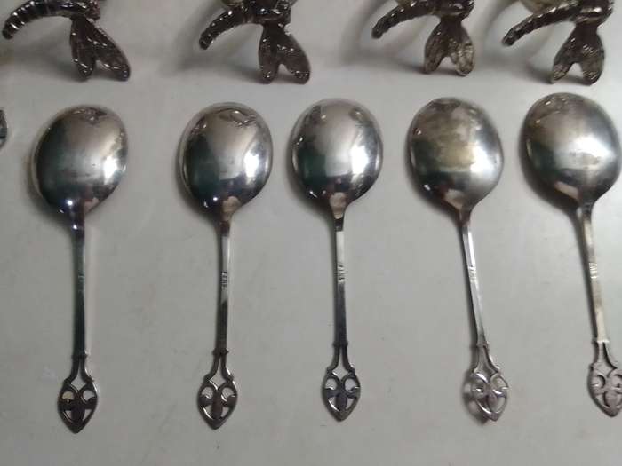 8 Grape fruit spoon set and 4 butterfly napkin rings