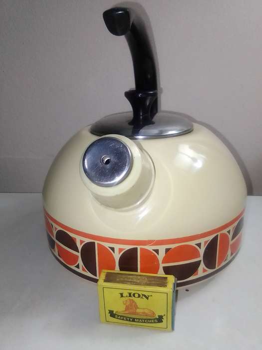 Fancy stove top whistling Kettle cream enamel with patons.