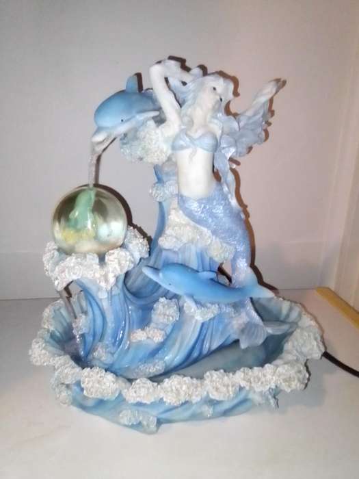 Mini Mermaid and 3 Dolphin's indoor fountain in polyresin and it's a working water display.