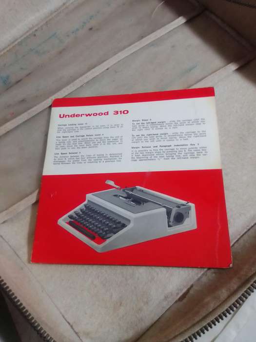 Vintage 1964 Underwood 310 Manuel Typewriter in Cary case with a receipt of repair & manual.