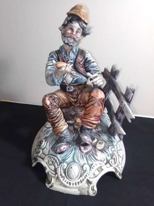 Very Large and impressive. Capodimonte Porcelain Hobo/Tramp/Begger man on Bench with bun in hand.