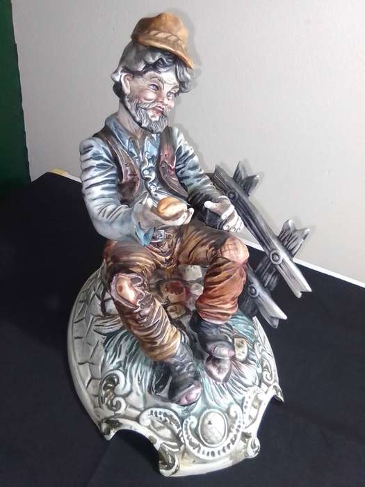 Very Large and impressive. Capodimonte Porcelain Hobo/Tramp/Begger man on Bench with bun in hand.