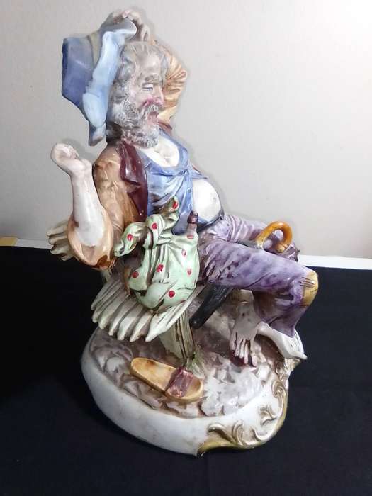 Large Vintage and heavy, Capodimonte Beggar man with umbrella + bag and floppy shoes.