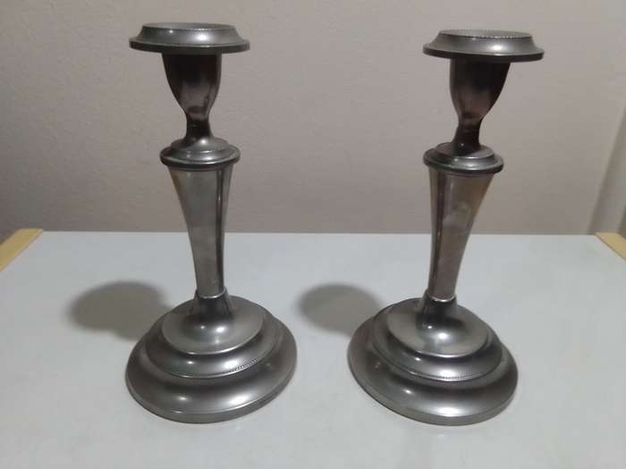 A Beautiful pair of weighted " Ianthe " candlesticks. In good condition for being antique. No dents.