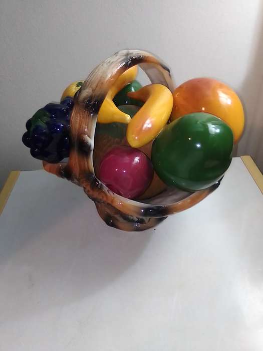 A ceramic decorative display Fruit basket marked B020 on the base.