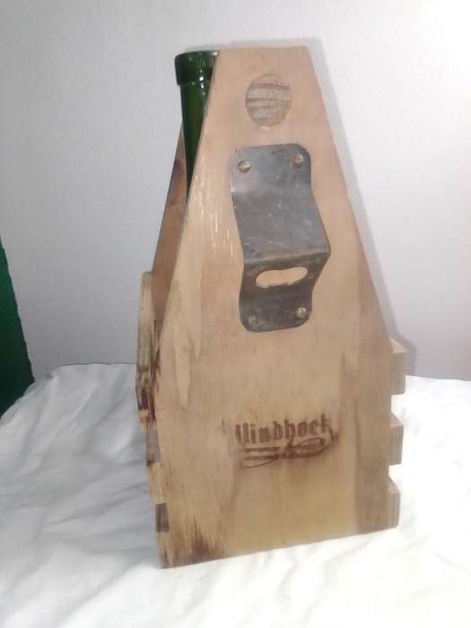 A Windhoek Beer wood Caddy/Carrier and with bottle opener.
