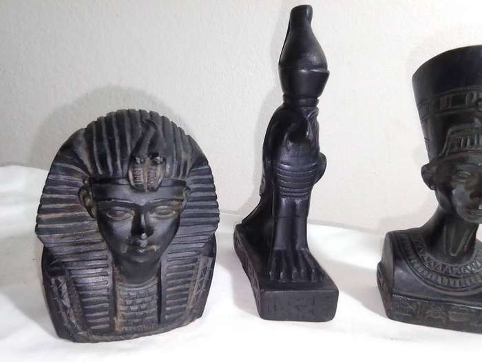 2 x Tutankhamun. Nefertiti busts, a Heart Scarab,2 x Bastet Head & Horus Falcon bird. Basalt Stone.