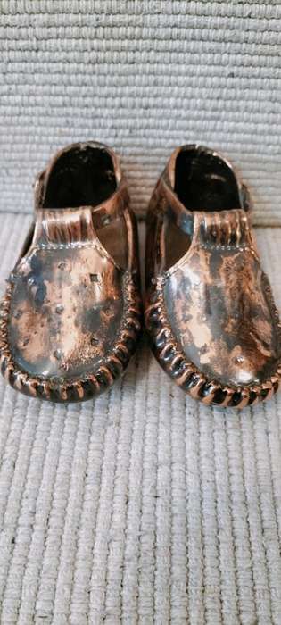 A Pair of Vintage Copper Plated Shoes