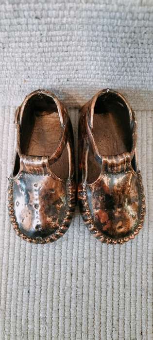 A Pair of Vintage Copper Plated Shoes