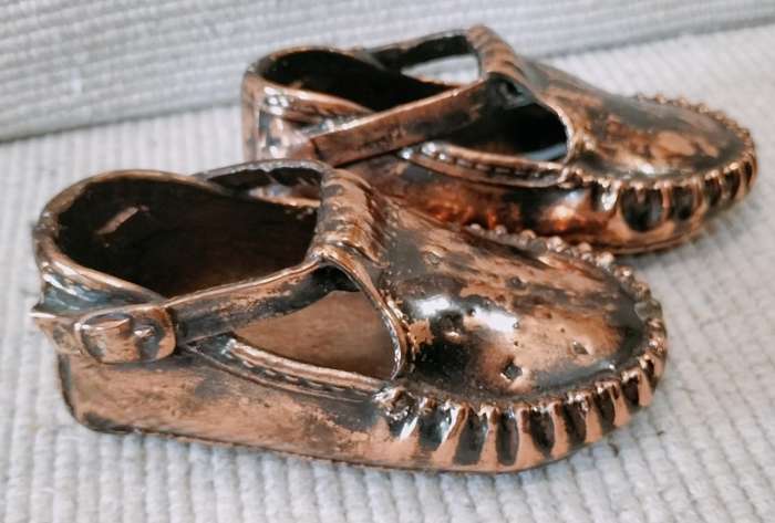 A Pair of Vintage Copper Plated Shoes