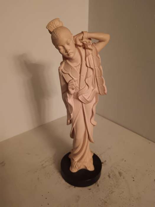 Asian Lady Figurine on a black Base