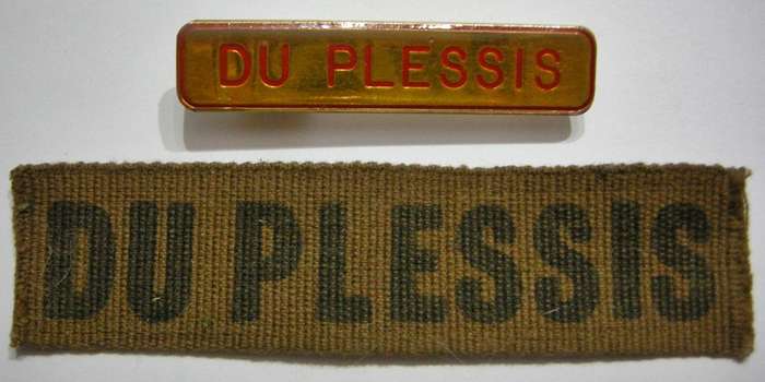 2 x Du Plessis Name Tags (1 x Metal, One Pin Repaired & 1 x Printed)
