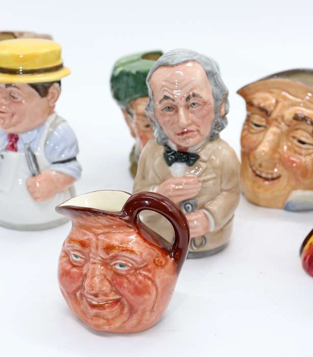 Collection of Royal Doulton character jugs , ashtrays and candle snufflers