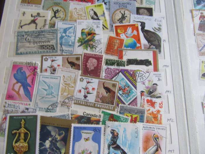 OLD STOCKBOOK - 14 PAGES FILLED WITH HUNDREDS OF INTERNATIONAL STAMPS - AS PER DCAN -BID PER PAGE -