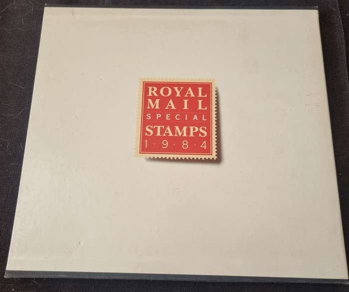 GB 1984 POST OFFICE YEAR BOOK IN 24 PAGE HARDBOUND BOOK WITH SLIP CASE. SG1236/71 CV GBP 85.