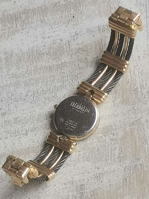 STUNNING LADIES MICHEL HERBELIN GOLD AND BLACK CABLE WATCH IN EXCL WORKING COND - VALUED OVER R15K