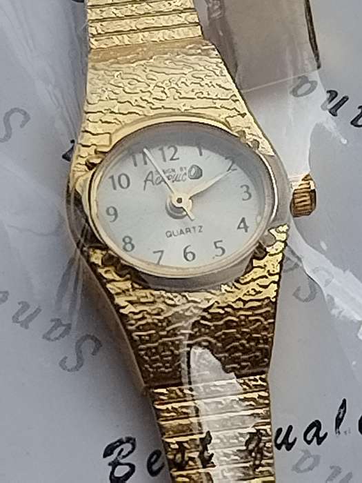 LADIES GOLD WATCH UNWORN STILL IN PLASTIC