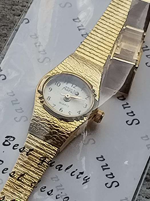 LADIES GOLD WATCH UNWORN STILL IN PLASTIC