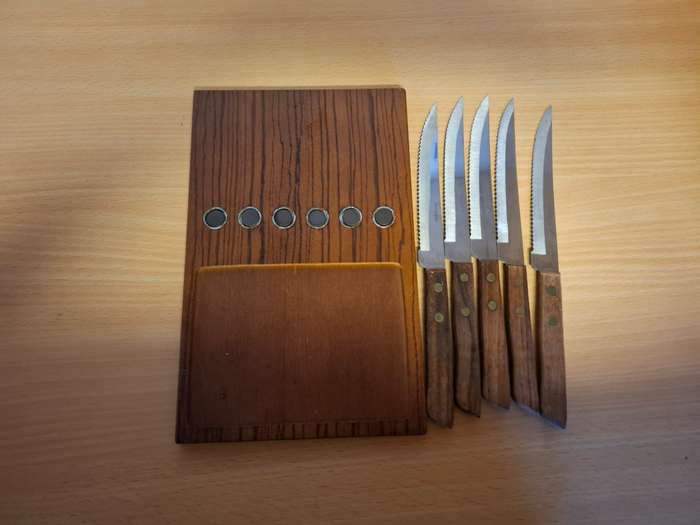 Set of 5 Steak Knives on a Wooden Board