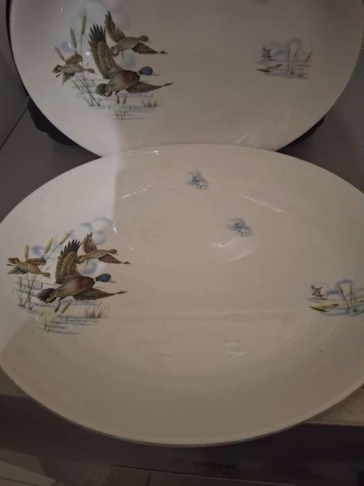 A vintage pair of flying ducks sence serving platters