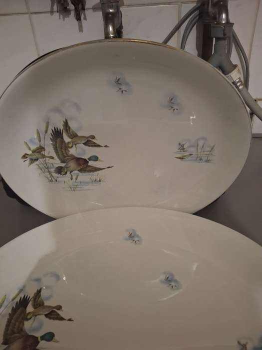 A vintage pair of flying ducks sence serving platters