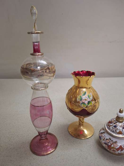 Two perfume bottles one glass venation vase