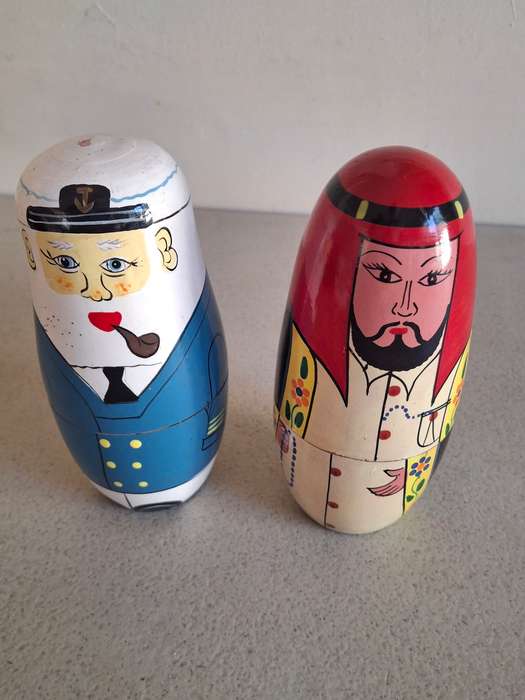 Two nesting dolls one is incomplete