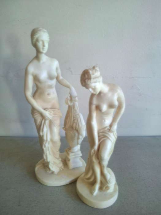 Two resin lady figurines