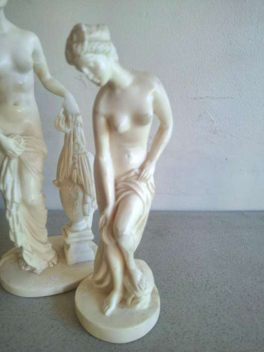 Two resin lady figurines