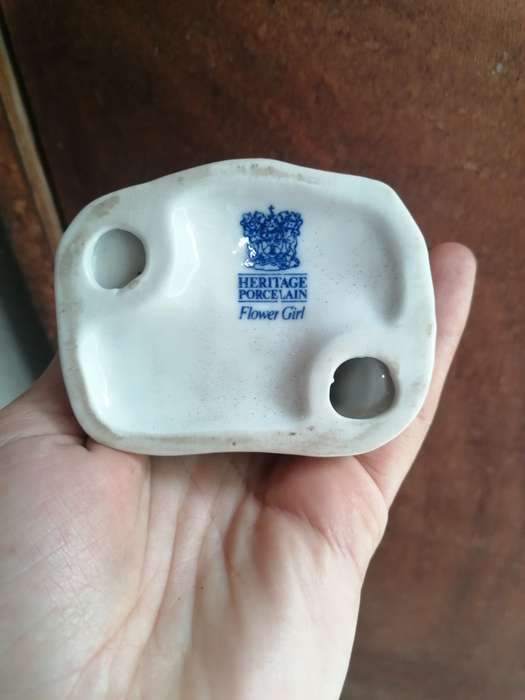 Heritage porcelain glower girl