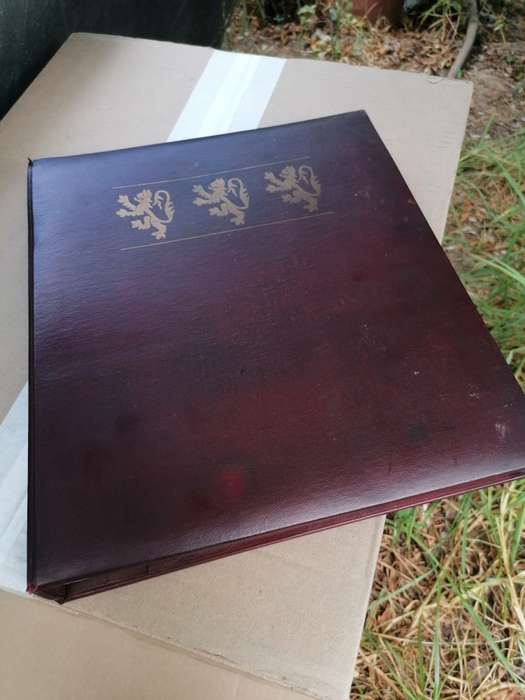 A BOOK of 22k Gold postage stamps, "The Royal Coats of Arms of the Kings and Queens of England", ple