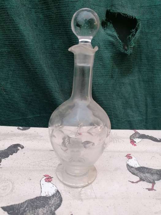 vintage etched glass decanter with a stopper,