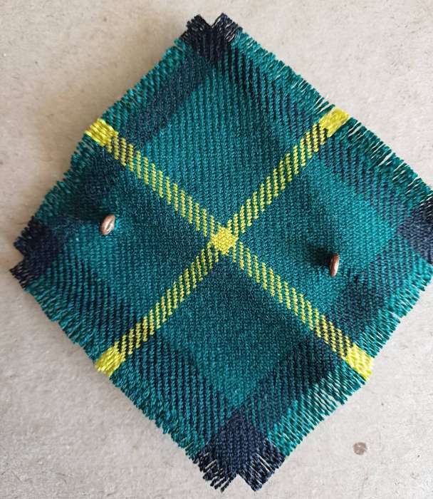 British Army, Gordon Highlanders WM Headdress badge with Gordon tartan swatch.