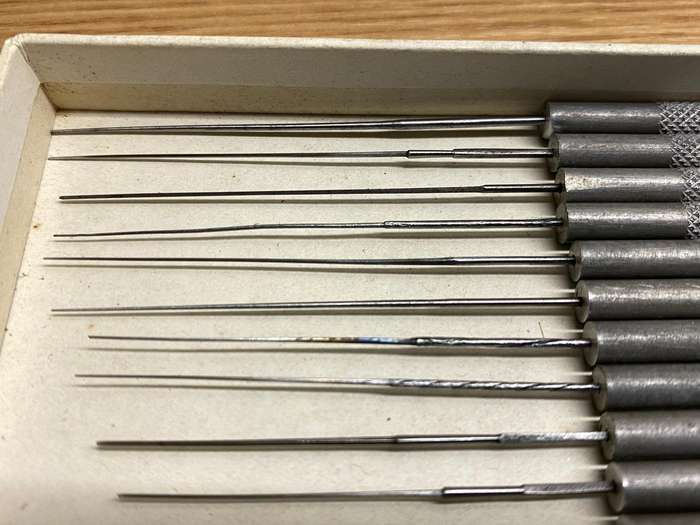 Watchmakers/jewelers cutting & smoothing broaches