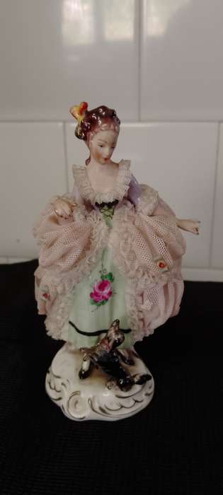 A Vintage Dresden figurine with puppy. 16cm high base 6x6cm