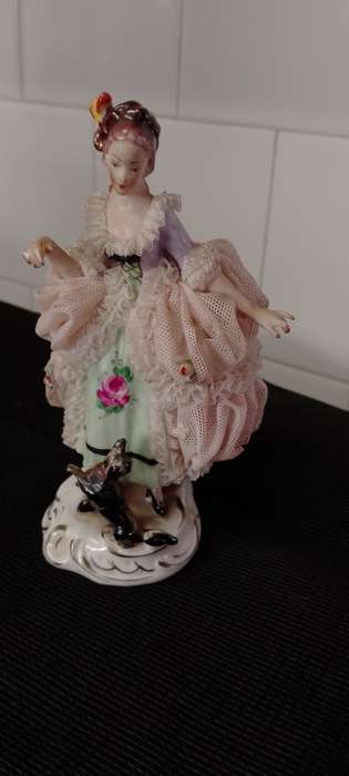 A Vintage Dresden figurine with puppy. 16cm high base 6x6cm