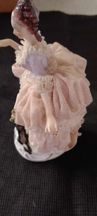 A Vintage Dresden figurine with puppy. 16cm high base 6x6cm