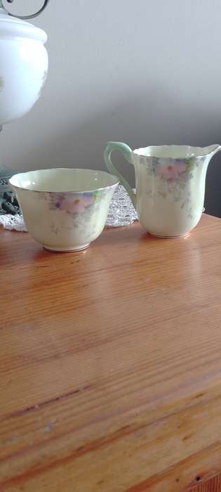 *#A VINTAGE CROWN STAFFORDSHIRE SUGAR AND CREAM SET.