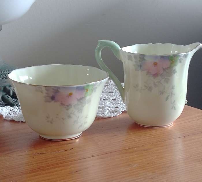 *#A VINTAGE CROWN STAFFORDSHIRE SUGAR AND CREAM SET.