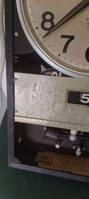 A vintage Seiko wall chiming clock. For parts only. Not working front cover missing.