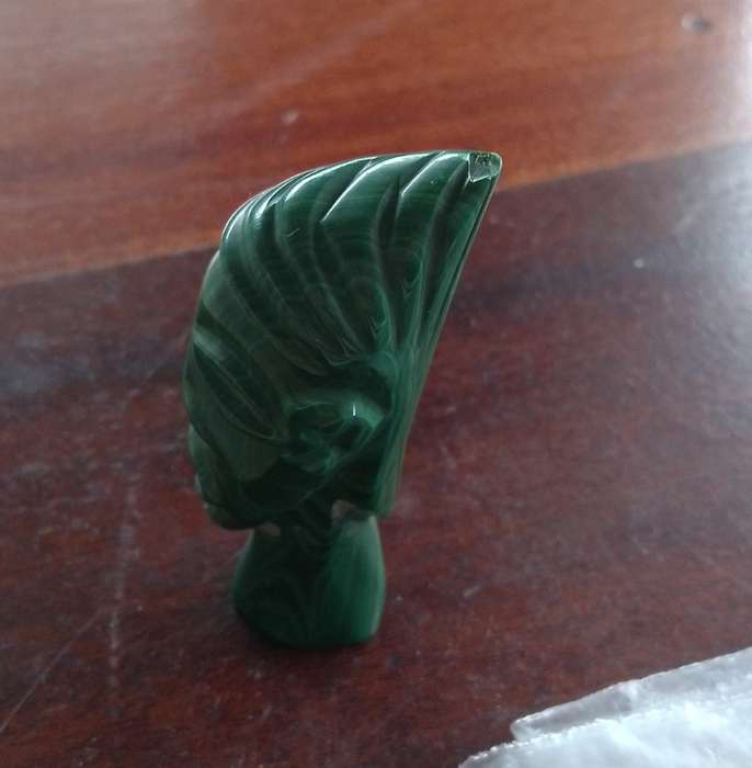 A Malachite "talking head" 7cm tall base 1.5cm across