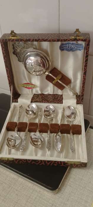 A EPNS vintage apostle tea spoons and tea strainer.