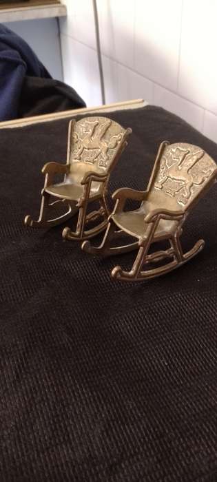 A Pair of antique Brass Chinese Dragon motive miniature rocking chairs.