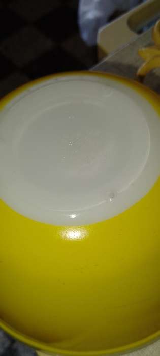 A Vintage yellow JAJ no.702 milk glass mixing bowl.