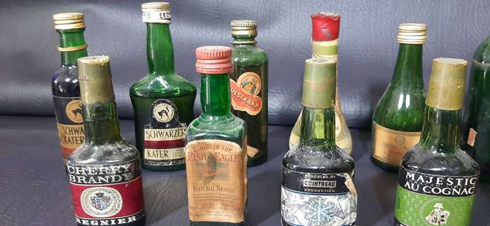 GREEN GLASS MINIATURE LIQUOR BOTTLES  VINTAGE BAR DISPLAY LOT OF 12