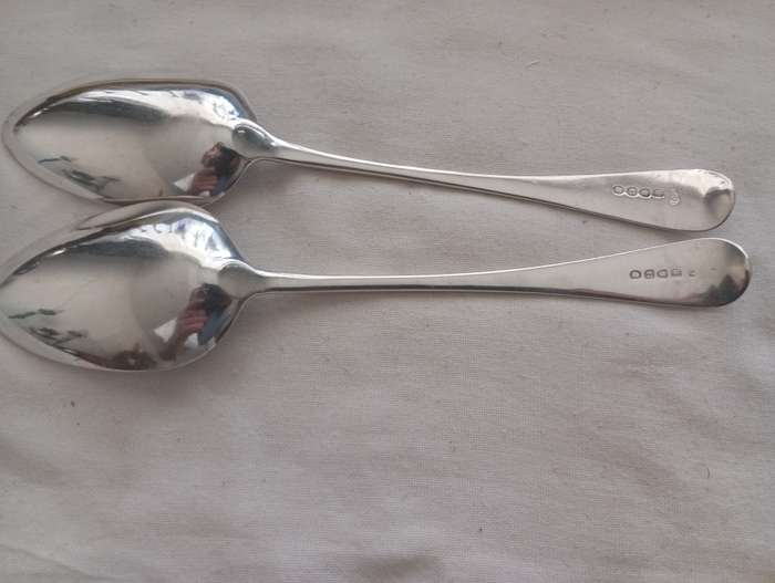 A matching pair of silver Georgian serving spoons