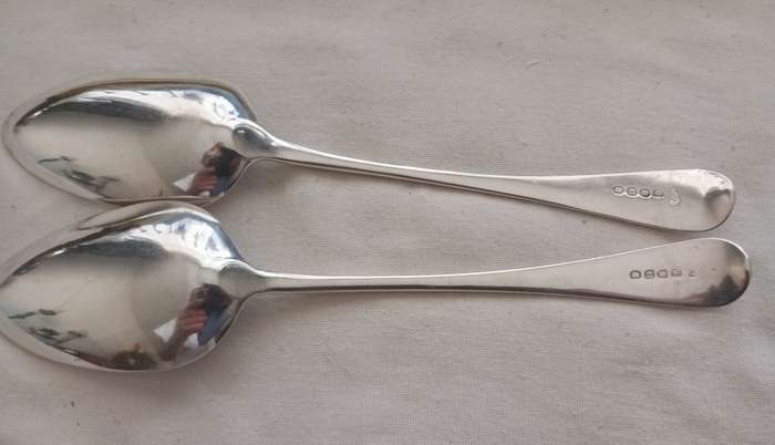 A matching pair of silver Georgian serving spoons