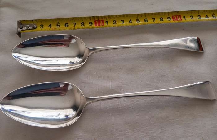 A matching pair of silver Georgian serving spoons