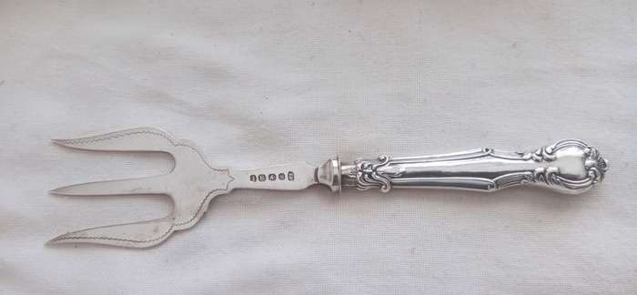 A lovely vintage silver cake fork
